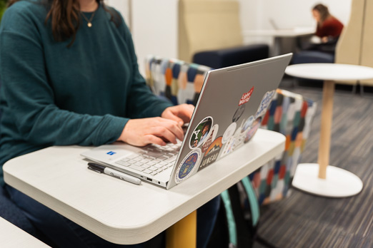 Woman typing at computer