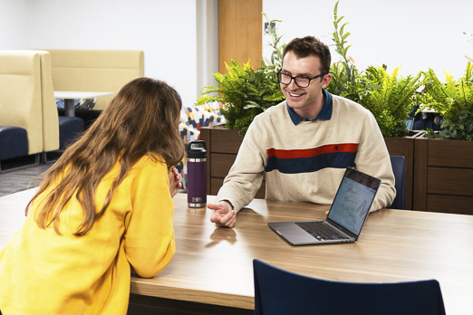 Counselor sharing resources with student