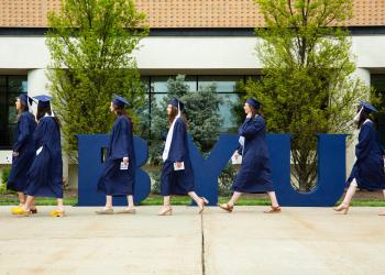 McKay School graduates encouraged to "be the power, be the hope, be the voice, and be the light that this world needs"