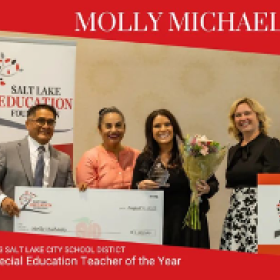 Molly Michaels Poses With Award